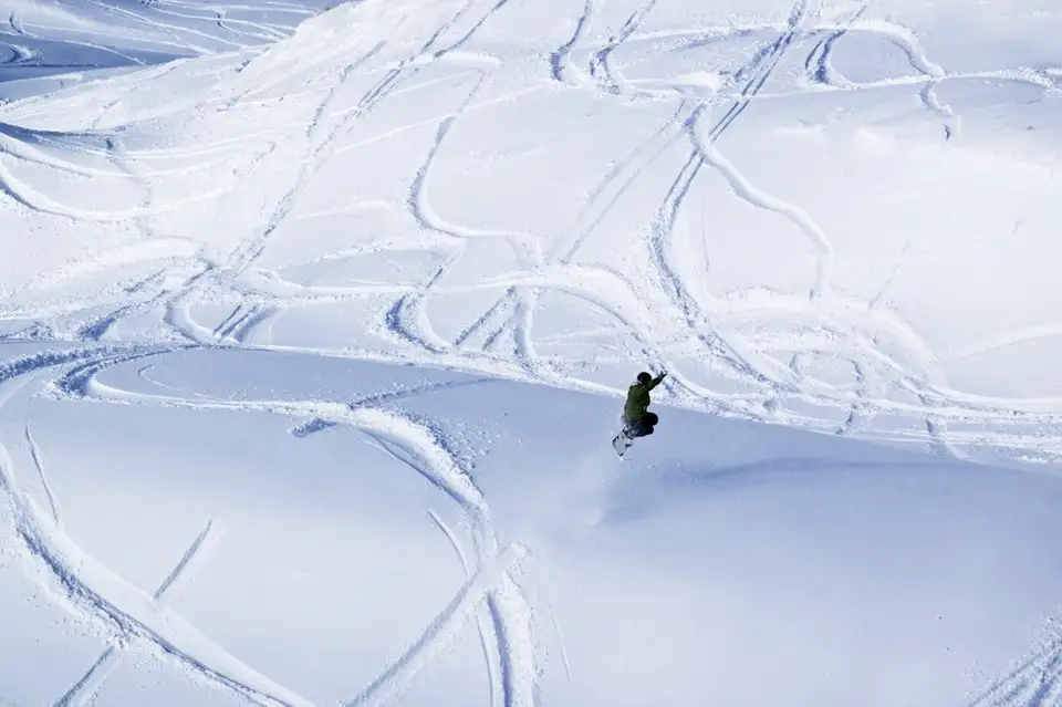 Catching air over fresh powdery snow at Coronet Peak media2