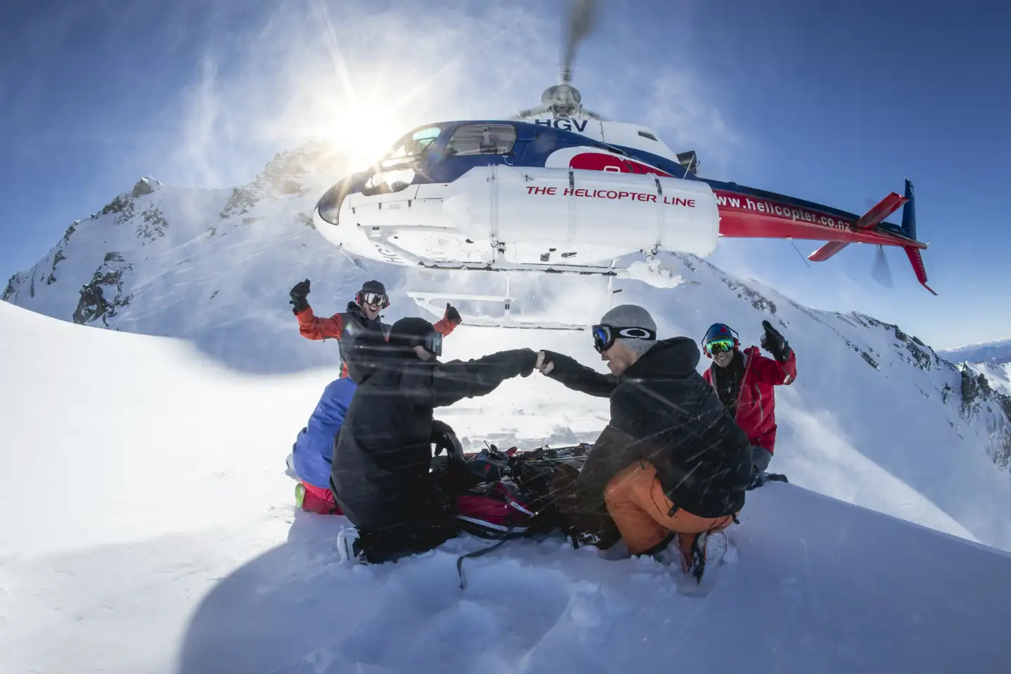 Group Landing With Heli Background
