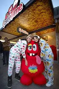 Josh Baldey (L) and Alana Potts (R) celebrate their year’s worth of free cookies