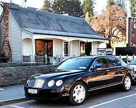 Luxury Bentley Flying Spur outside Botswana Butchery Queenstown