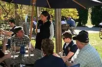 Appellation Central guide Kirsty serves wine at Olssens Winery in Bannockburn