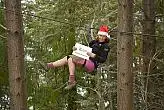 A Christmas-zipper flying high above Queenstown