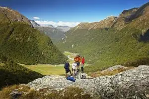 Hikers take in the view down the Routeburn Valley