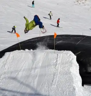 A boarder gets air before safely landing in the AirBag at The Remarkables