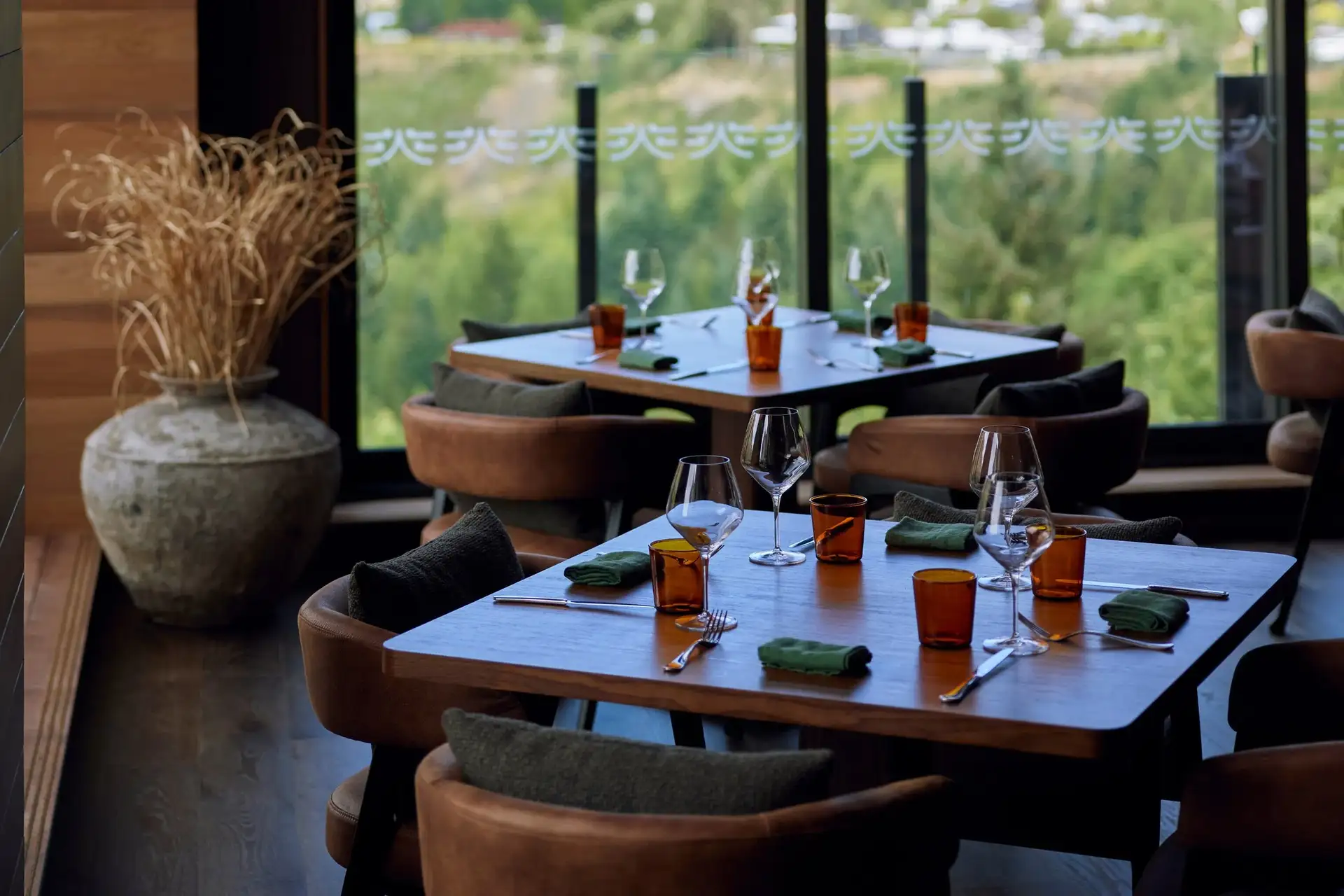 Dining area at Elevation Bar & Restaurant with mountain views over the Shotover River