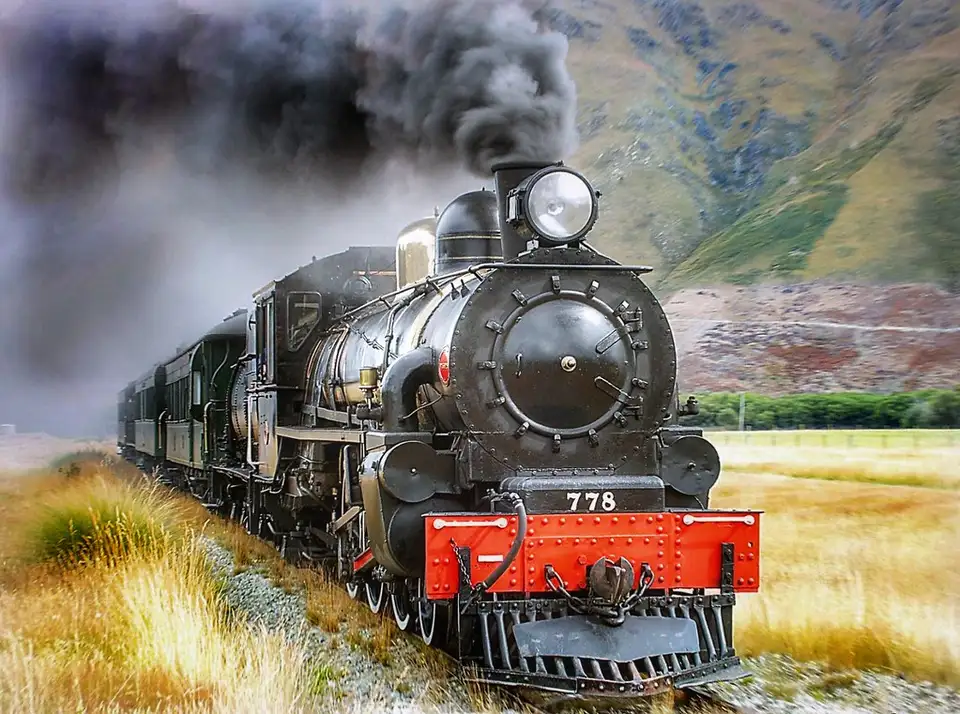 The Kingston Flyer's vintage steam locomotive under steam beside the platform at Kingston