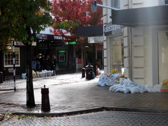 Sand bags protecting Glassons and True Grit